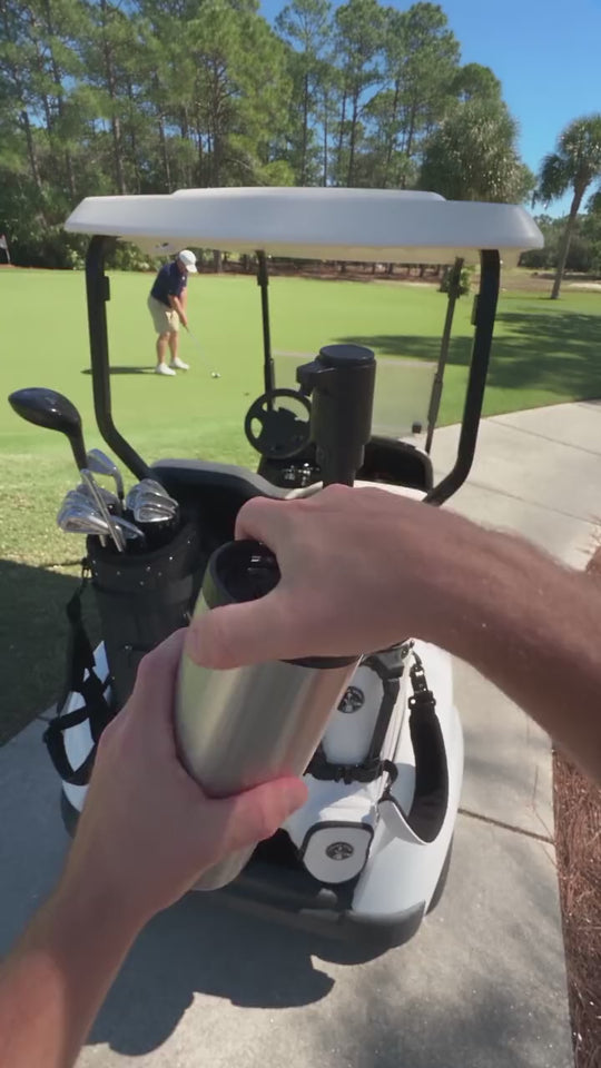 Filling a travel mug from a FIFTH IRON at the cart