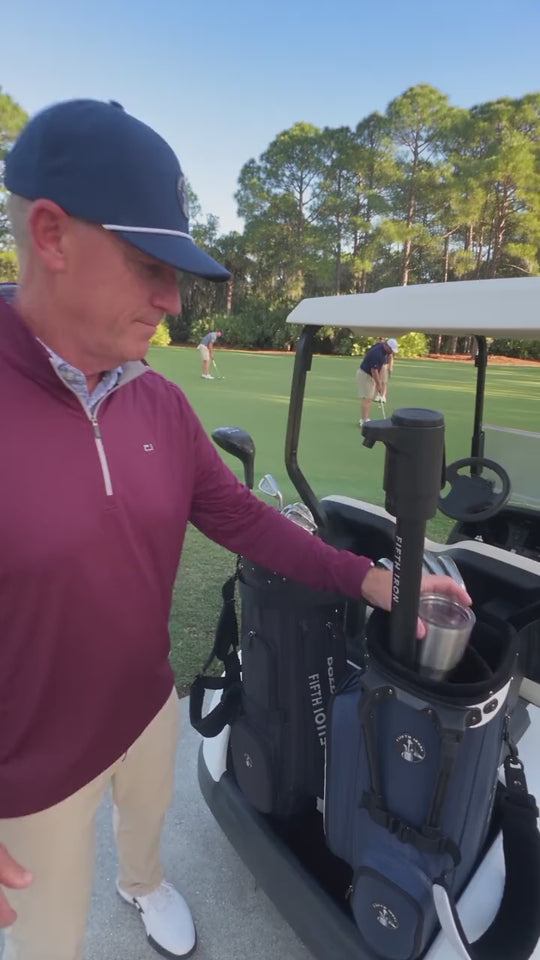 Golfer filling a travel mug from a FIFTH IRON on a morning round